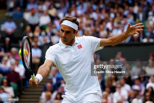Roger Federer of Switzerland plays a backhand during his men's Singles Quarter Final match against Hubert Hurkacz of Poland on Day Nine of The...