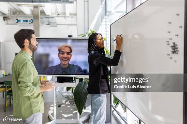 startup business team brainstorming new ideas in hybrid office - employee engagement remote stock pictures, royalty-free photos & images