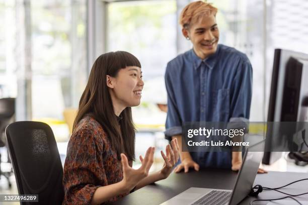 business people having a video call in office - asian man seated stock pictures, royalty-free photos & images