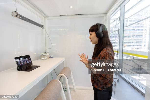 woman having video call in hybrid office - employee engagement remote stock pictures, royalty-free photos & images