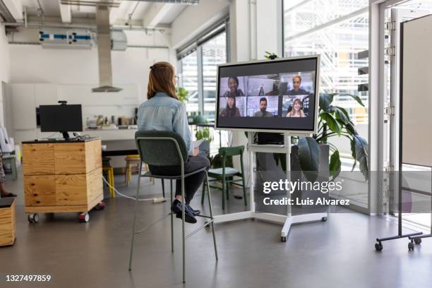 businesswoman having video call with team - employee engagement remote stock pictures, royalty-free photos & images