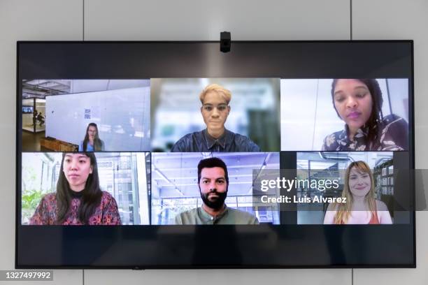 business team having high tech video conference meeting - black and white tv stock-fotos und bilder