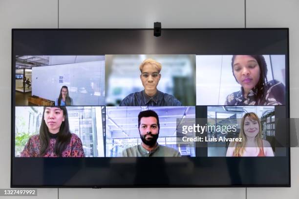 business team having high tech video conference meeting - skypen stockfoto's en -beelden