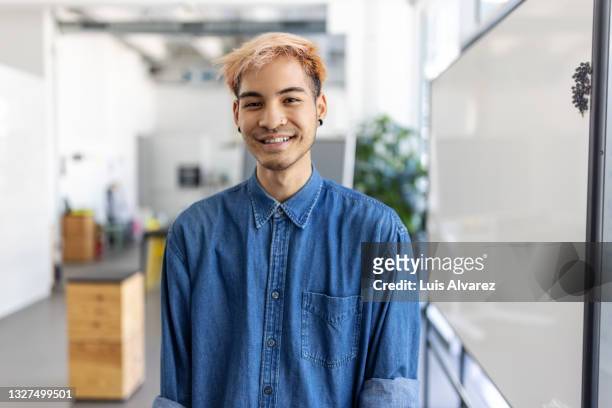 portrait of a young businessman in casuals at office - gen z work stock pictures, royalty-free photos & images