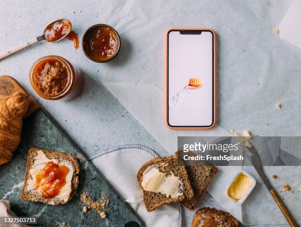 mobile phone as part of a breakfast flat lay - croissant jam stock pictures, royalty-free photos & images