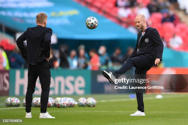 Nicolai Boilesen of Denmark controls the ball as he inspects the pitch prior to the UEFA Euro 2020 Championship Semi-final match between England and...