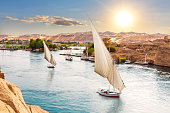 Traditional Nile sailboats near the banks of Aswan, Egypt