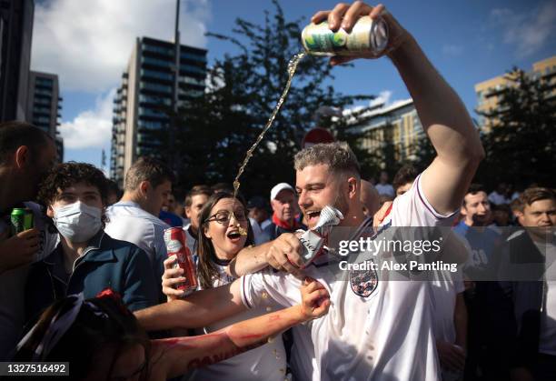 Fans throw beer during the UEFA Euro 2020 Championship Semi-final match between England and Denmark at Wembley Stadium on July 07, 2021 in London,...