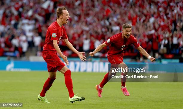 Mikkel Damsgaard of Denmark celebrates after scoring their side's first goal during the UEFA Euro 2020 Championship Semi-final match between England...