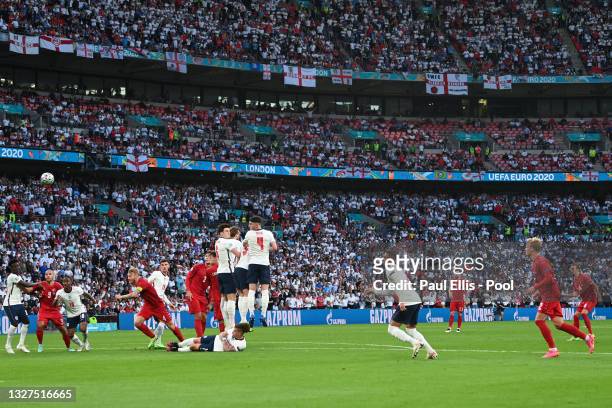 Mikkel Damsgaard of Denmark scores their team's first goal from a free kick during the UEFA Euro 2020 Championship Semi-final match between England...