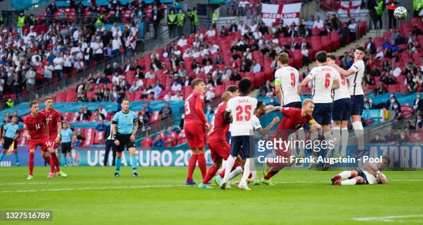 Mikkel Damsgaard of Denmark scores their team's first goal from a free kick during the UEFA Euro 2020 Championship Semi-final match between England...
