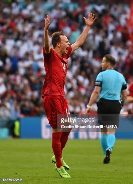 Mikkel Damsgaard of Denmark celebrates after scoring their team's first goal during the UEFA Euro 2020 Championship Semi-final match between England...
