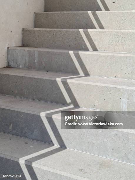light and shadow on stairs - staircase photos et images de collection