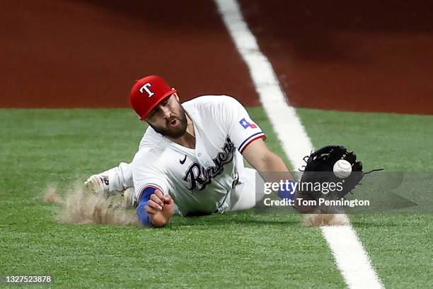 Joey Gallo of the Texas Rangers fails to make the catch on a RBI single hit by Jonathan Schoop of the Detroit Tigers in the top of the seventh inning...