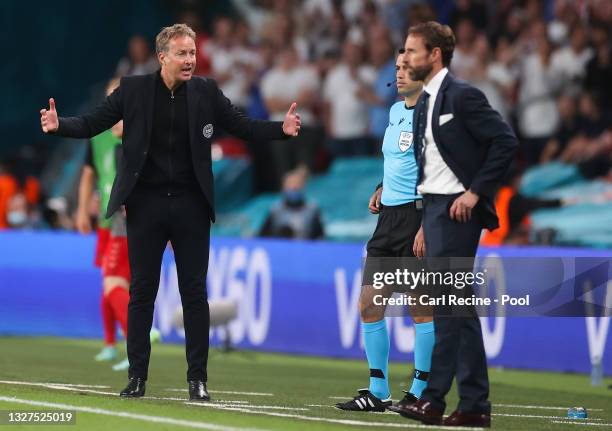 Kasper Hjulmand, Head Coach of Denmark reacts towards Gareth Southgate, Head Coach of England during the UEFA Euro 2020 Championship Semi-final match...