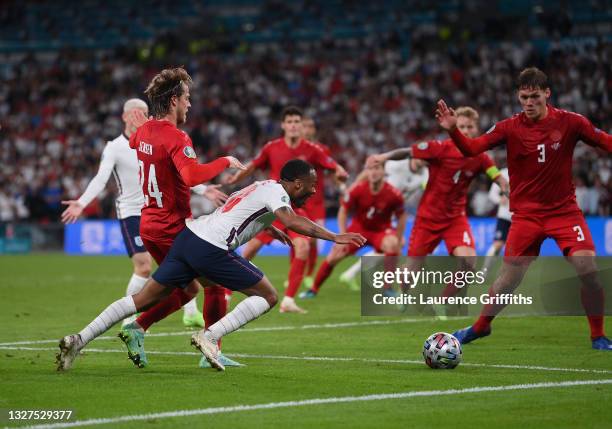 Raheem Sterling of England is fouled by Mathias Jensen of Denmark inside the penalty area, leading to England being awarded a penalty during the UEFA...