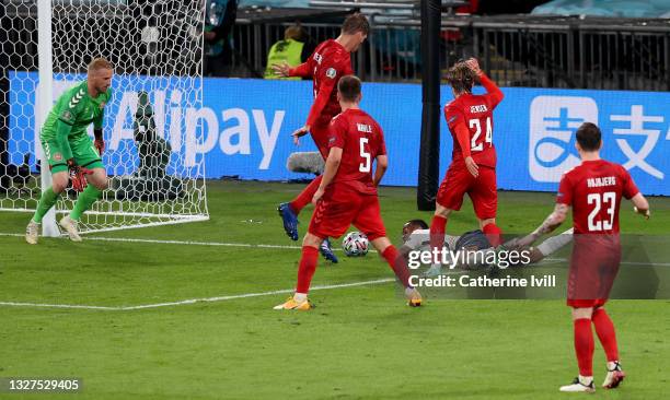 Raheem Sterling of England is fouled by Mathias Jensen of Denmark inside the penalty area, leading to England being awarded a penalty during the UEFA...