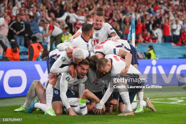 Harry Kane of England celebrates with team mates after scoring their side's second goal during the UEFA Euro 2020 Championship Semi-final match...