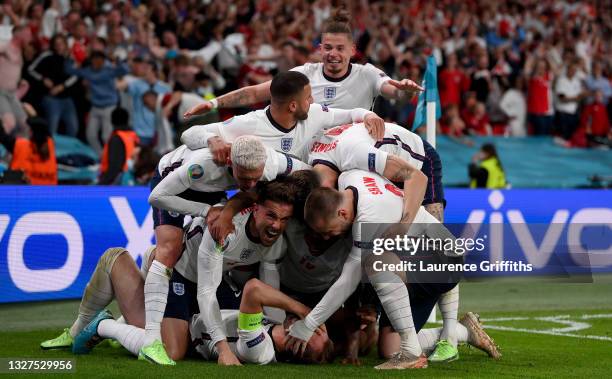 Harry Kane of England celebrates with team mates after scoring their side's second goal during the UEFA Euro 2020 Championship Semi-final match...