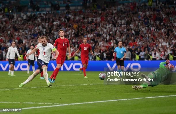 Harry Kane of England scores from the rebound of a missed penalty for their team's second goal during the UEFA Euro 2020 Championship Semi-final...