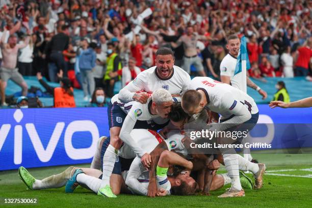 Harry Kane of England celebrates with team mates after scoring their side's second goal during the UEFA Euro 2020 Championship Semi-final match...