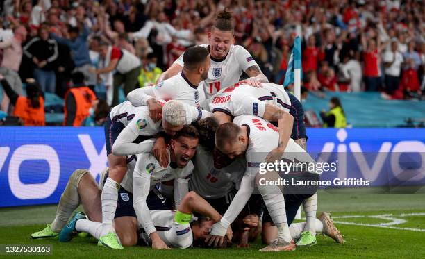 Harry Kane of England celebrates with team mates after scoring their side's second goal during the UEFA Euro 2020 Championship Semi-final match...