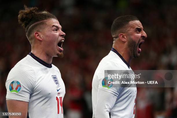 Kalvin Phillips and Kyle Walker of England celebrate their team's second goal during the UEFA Euro 2020 Championship Semi-final match between England...