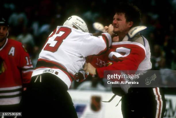 March 23: Bob Probert of the Chicago Blackhawks is shown fighting with Reid Simpson of the New Jersey Devils in the game between the Chicago...