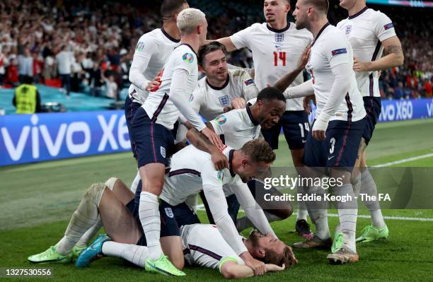 Harry Kane of England celebrates with team mates after scoring their side's second goal during the UEFA Euro 2020 Championship Semi-final match...