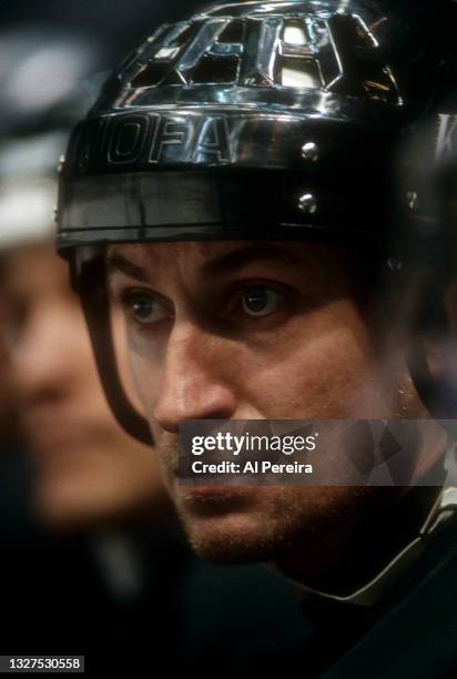 Wayne Gretzky of the Los Angeles Kings follows the action from the bench in the game between the Los Angeles Kings vs The New Jersey Devils at the...