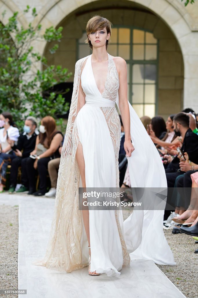 A model walks the runway during the Zuhair Murad Couture Haute... News ...