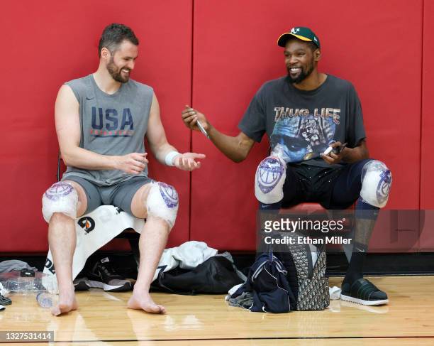 Kevin Love and Kevin Durant of the 2021 USA Basketball Men's National Team share a laugh after a practice at the Mendenhall Center at UNLV as the...