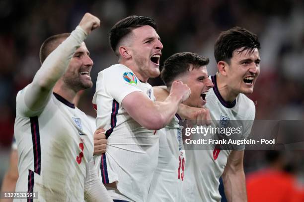 Luke Shaw, Declan Rice, Mason Mount and Harry Maguire of England celebrate their side's victory after the UEFA Euro 2020 Championship Semi-final...