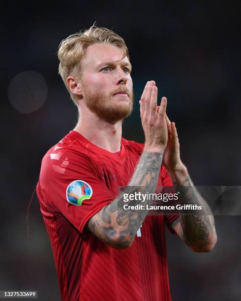 Simon Kjaer of Denmark applauds the fans following defeat in the UEFA Euro 2020 Championship Semi-final match between England and Denmark at Wembley...
