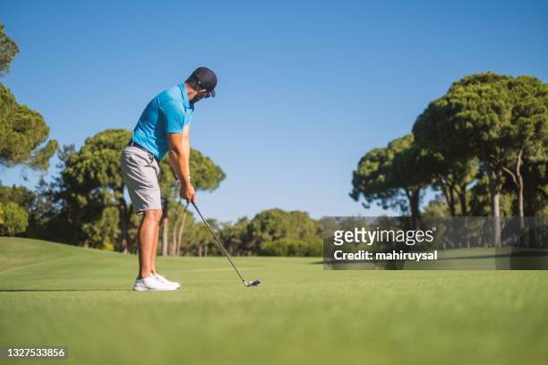 playing golf - golf stock pictures, royalty-free photos & images