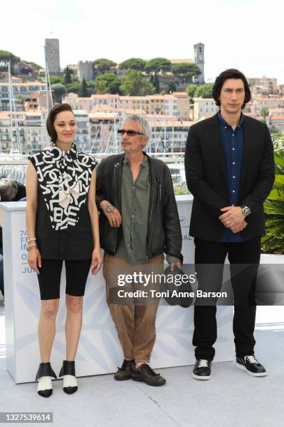 Marion Cotillard, Leos Carax and Adam Driver attend the "Annette" photocall during the 74th annual Cannes Film Festival on July 06, 2021 in Cannes,...