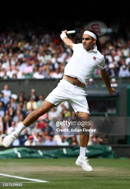 Roger Federer of Switzerland plays a backhand during his men's Singles Quarter Final match against Hubert Hurkacz of Poland on Day Nine of The...