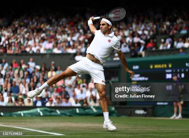 Roger Federer of Switzerland plays a backhand during his men's Singles Quarter Final match against Hubert Hurkacz of Poland on Day Nine of The...