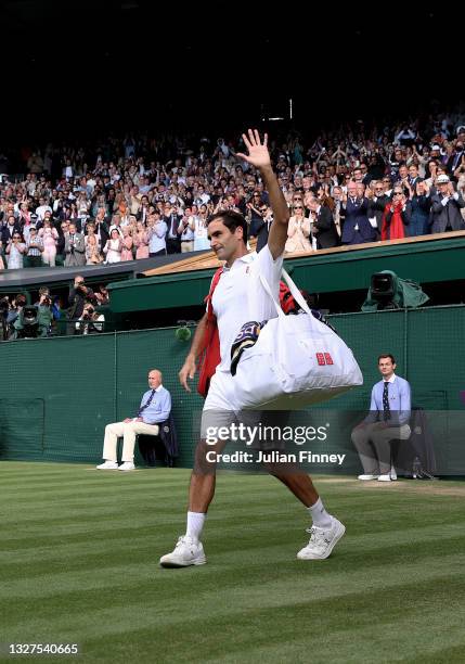 Roger Federer of Switzerland walks off court after losing his men's Singles Quarter Final match against Hubert Hurkacz of Poland on Day Nine of The...