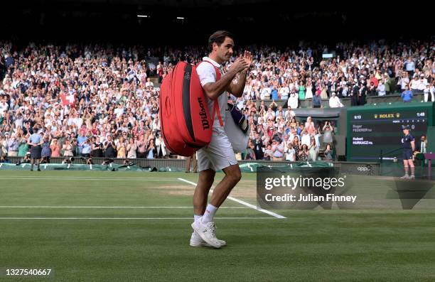 Roger Federer of Switzerland walks off court after losing his men's Singles Quarter Final match against Hubert Hurkacz of Poland on Day Nine of The...