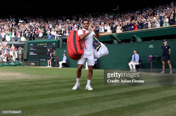 Roger Federer of Switzerland walks off court after losing his men's Singles Quarter Final match against Hubert Hurkacz of Poland on Day Nine of The...