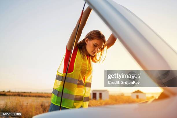 one desperate woman looking at broken down car engine - engine failure stock pictures, royalty-free photos & images