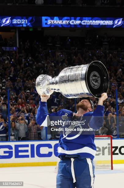 Steven Stamkos of the Tampa Bay Lightning hoists the Stanley Cup after the 1-0 victory against the Montreal Canadiens in Game Five to win the 2021...