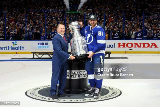 Commissioner Gary Bettman presents Steven Stamkos of the Tampa Bay Lightning with the Stanley Cup after the 1-0 victory against the Montreal...