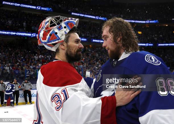 Goaltenders Carey Price of the Montreal Canadiens and Andrei Vasilevskiy of the Tampa Bay Lightning share words in the handshake line after the Tampa...