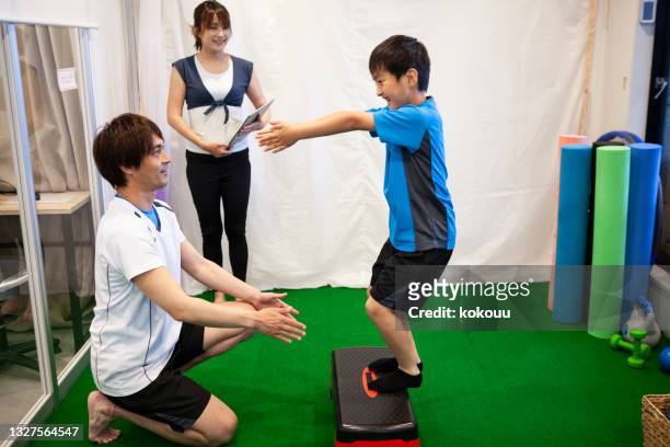 real lifestyle of a sports family enjoying training. - gym excercise ball stock pictures, royalty-free photos & images