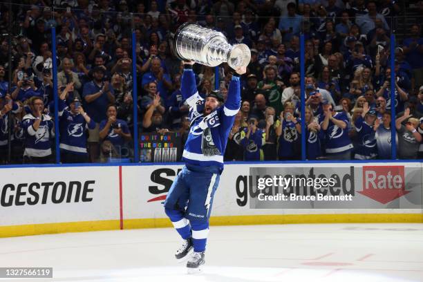 Pat Maroon of the Tampa Bay Lightning hoists the Stanley Cup after the 1-0 victory against the Montreal Canadiens in Game Five to win the 2021 NHL...