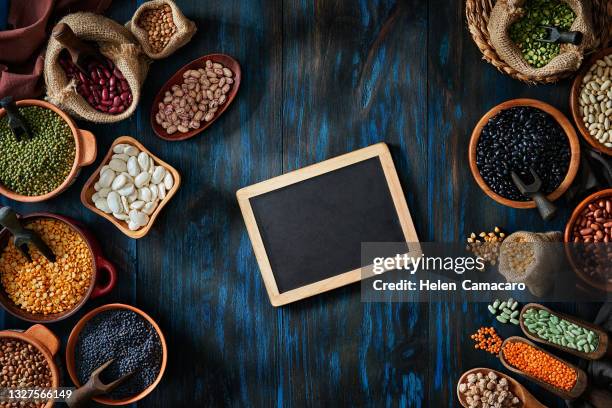 legumes and beans on a rustic wooden table with  a board and copy space - black eyed peas food stock pictures, royalty-free photos & images