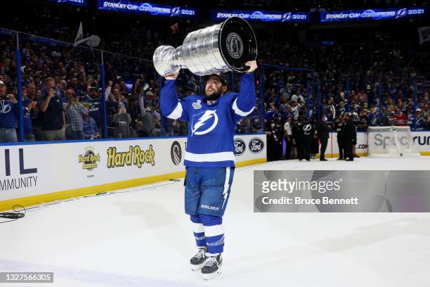 Tyler Johnson of the Tampa Bay Lightning celebrates with the Stanley Cup after the 1-0 victory against the Montreal Canadiens in Game Five to win the...