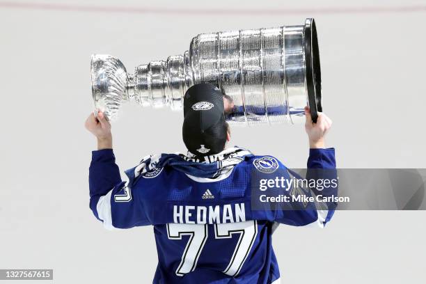 Victor Hedman of the Tampa Bay Lightning hoists the Stanley Cup after the 1-0 victory against the Montreal Canadiens in Game Five to win the 2021 NHL...